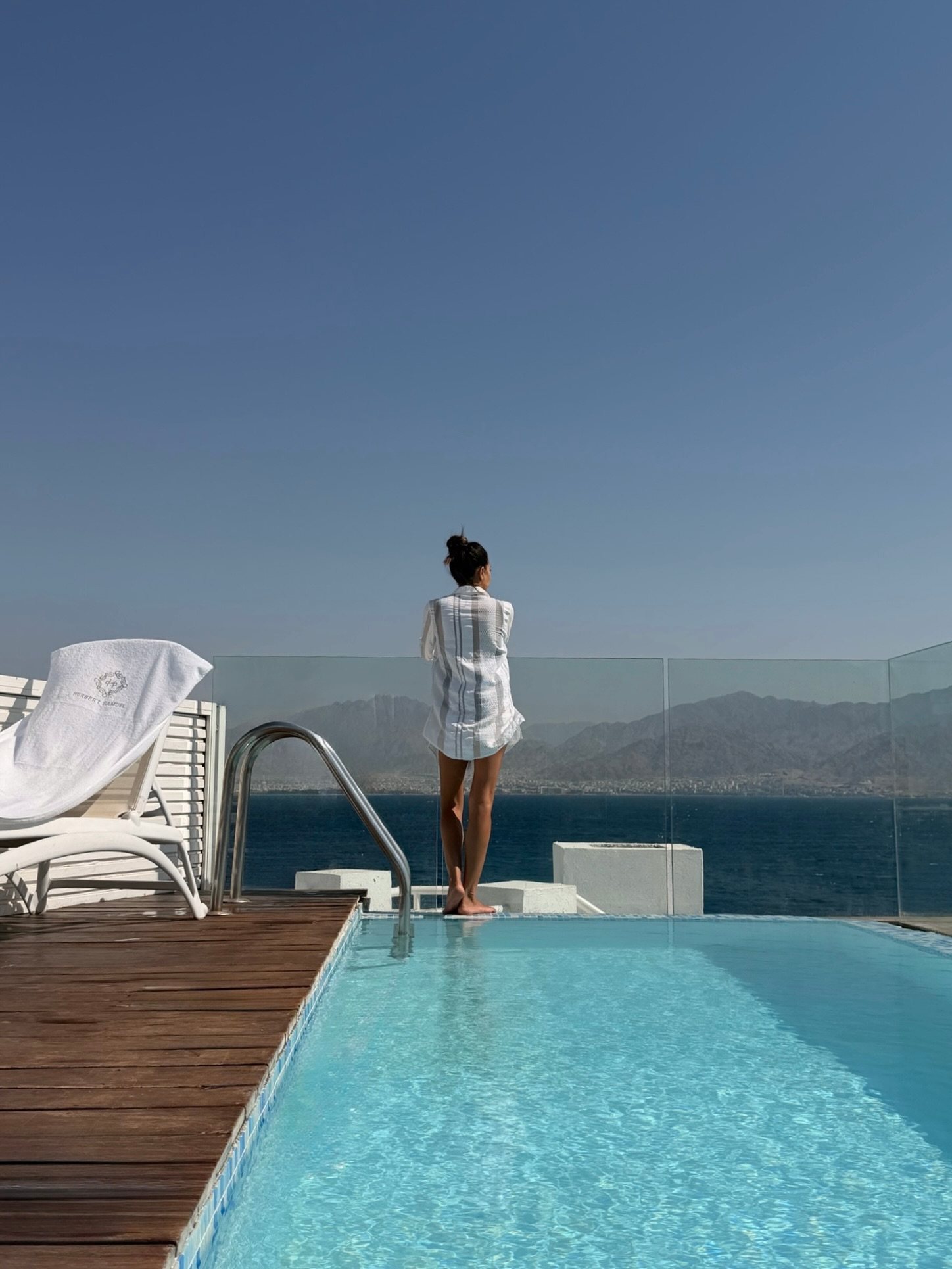 A guest at the edge of the pool