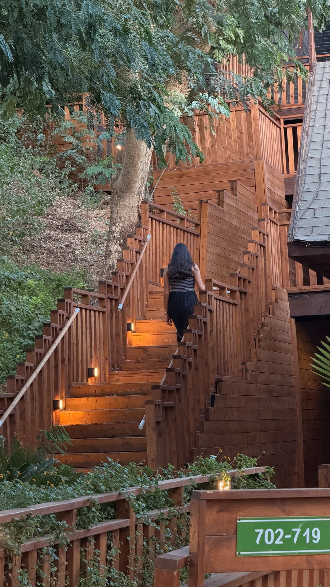 The wooden stairs down through the gardens