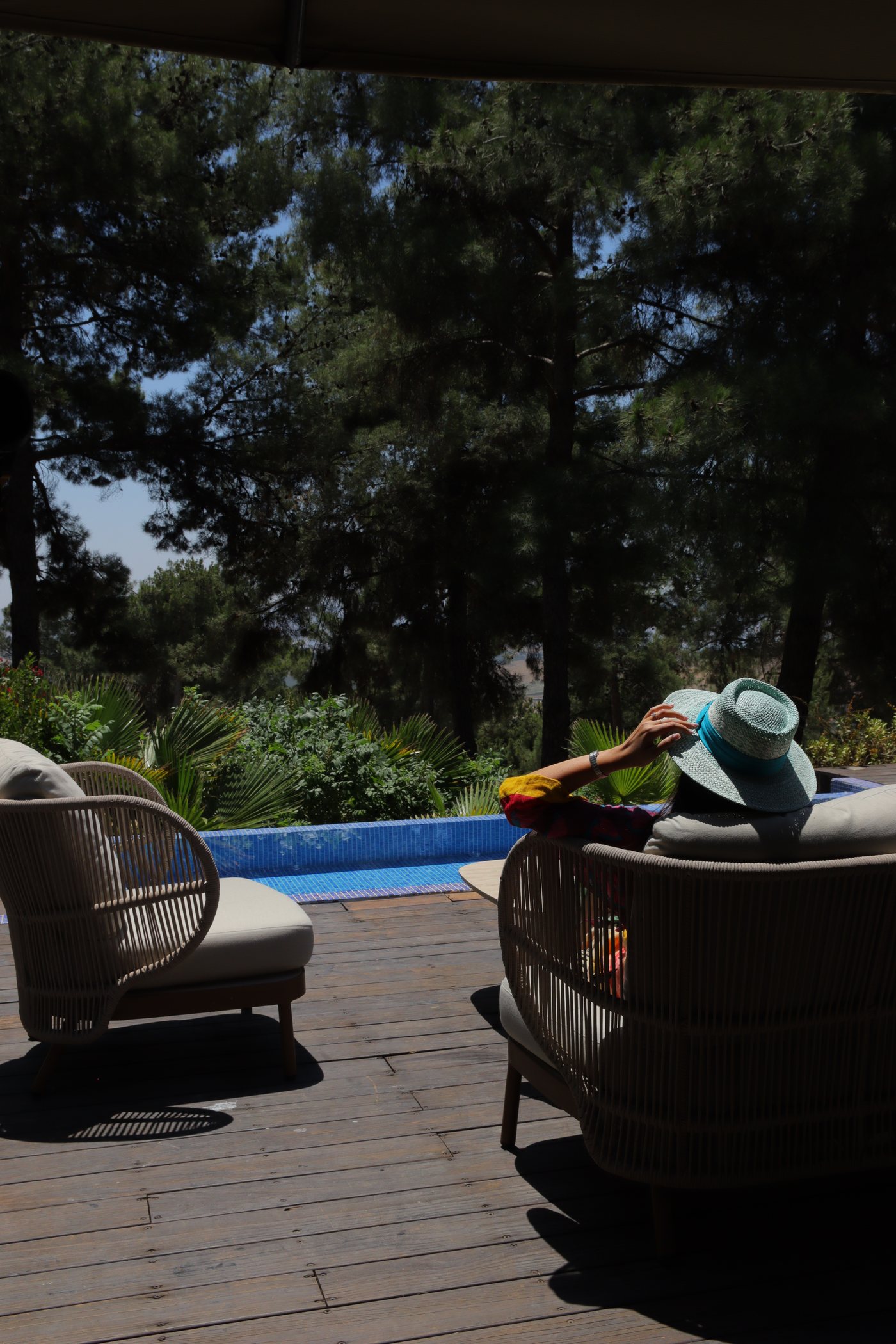 Deck chairs by the pool as the light drops