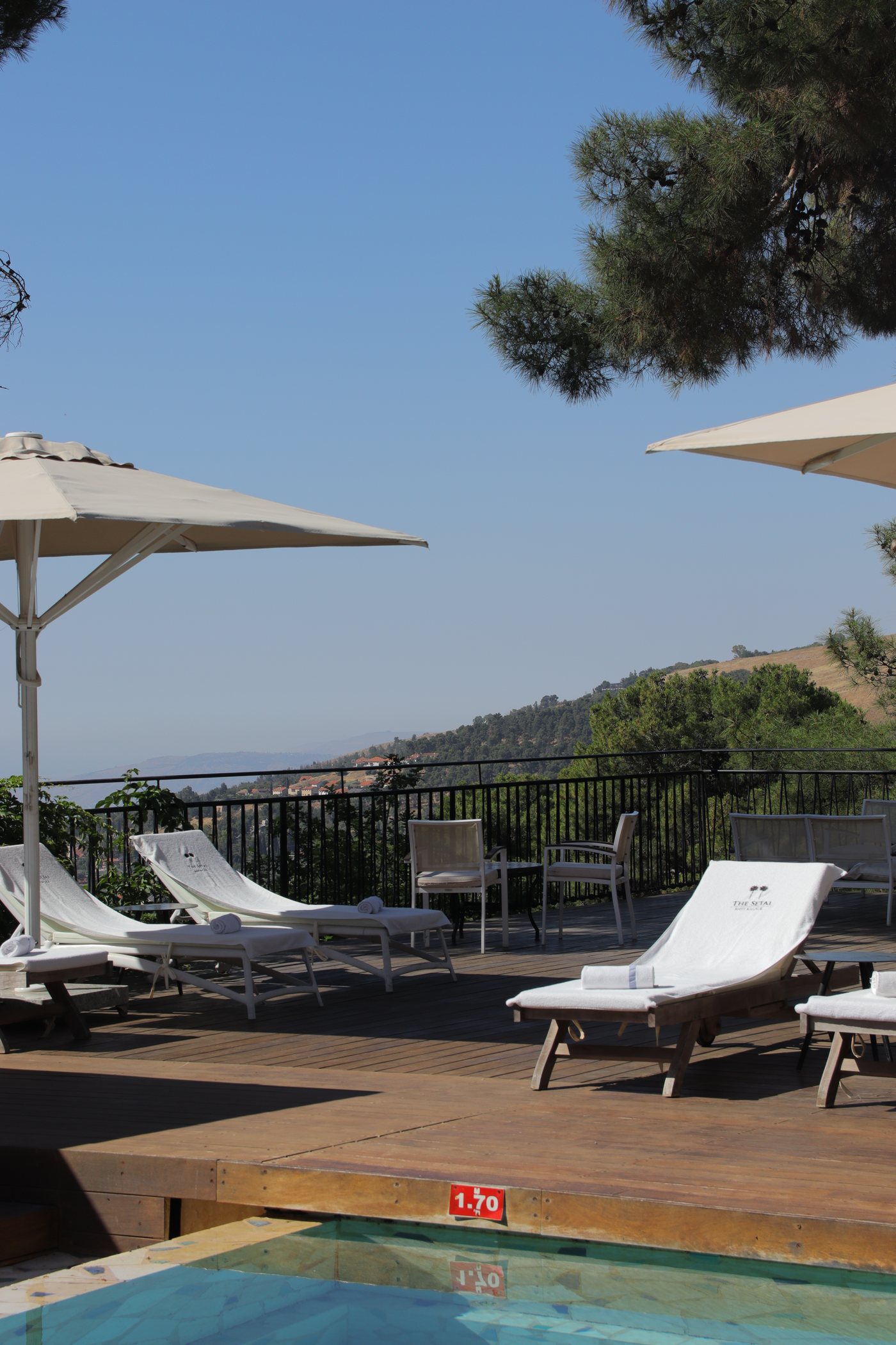 The deck and its loungers, looking out over the hills