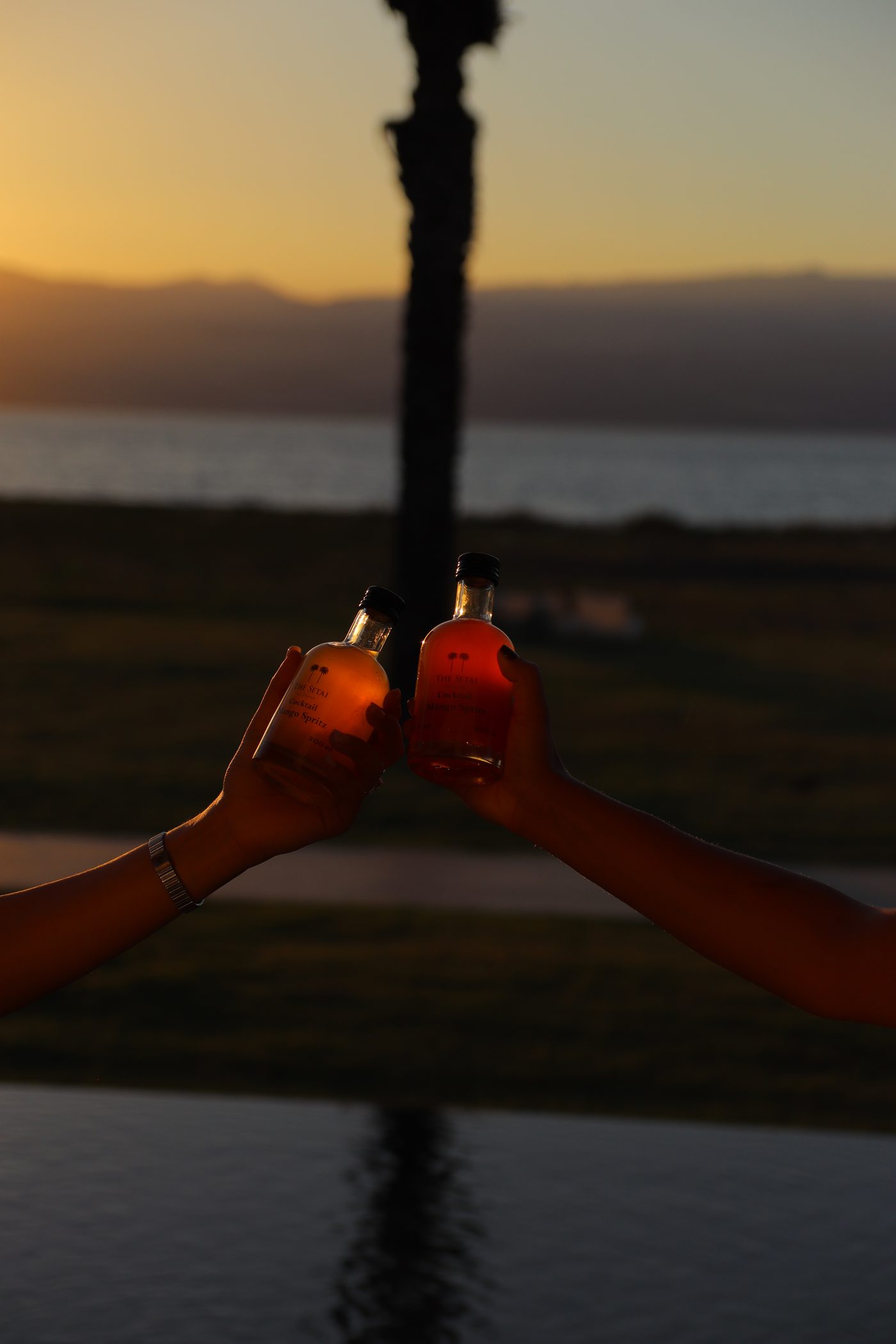 A toast at sunset, the lake behind