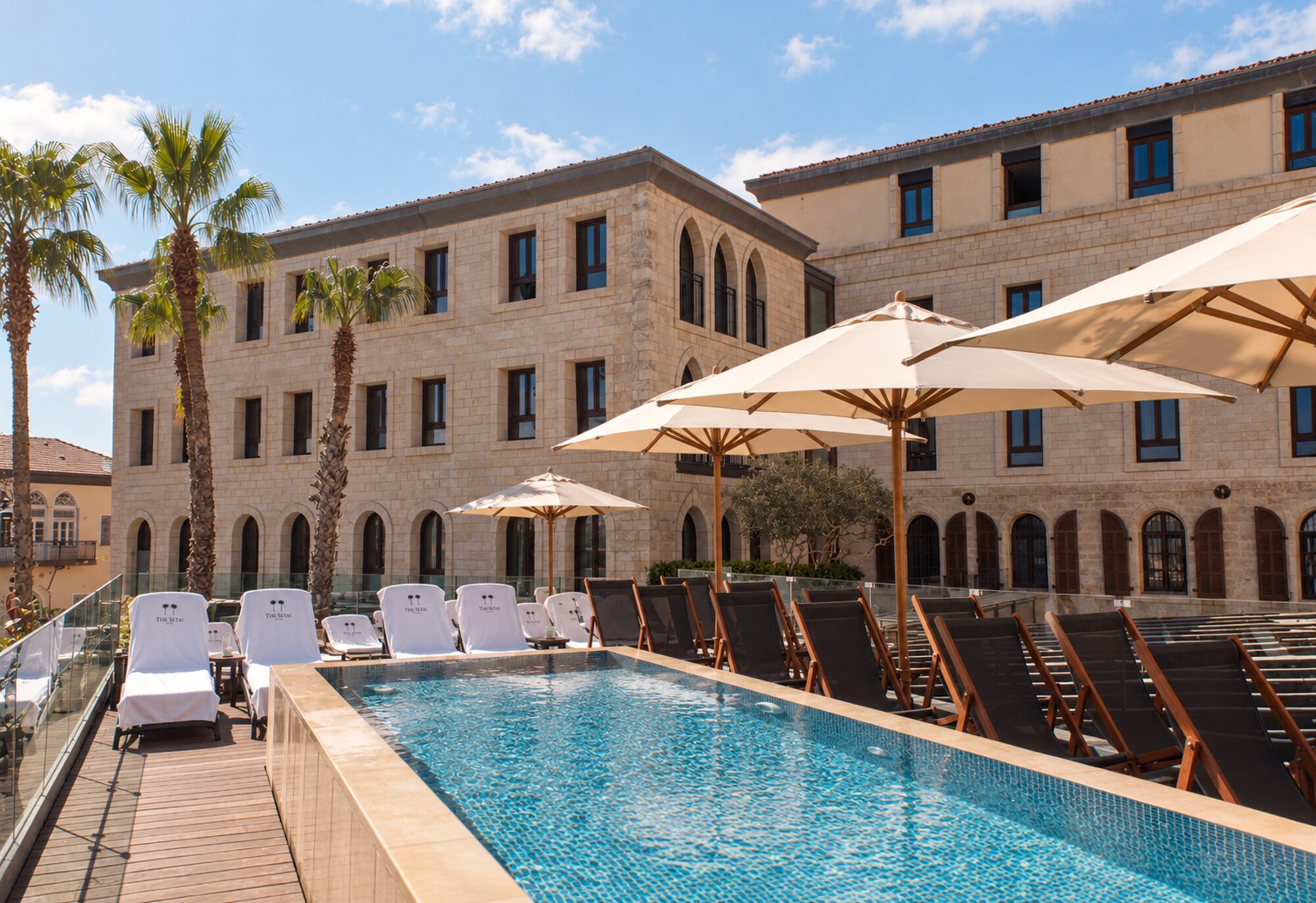 The Setai Tel Aviv — the rooftop pool and the historic stone facade