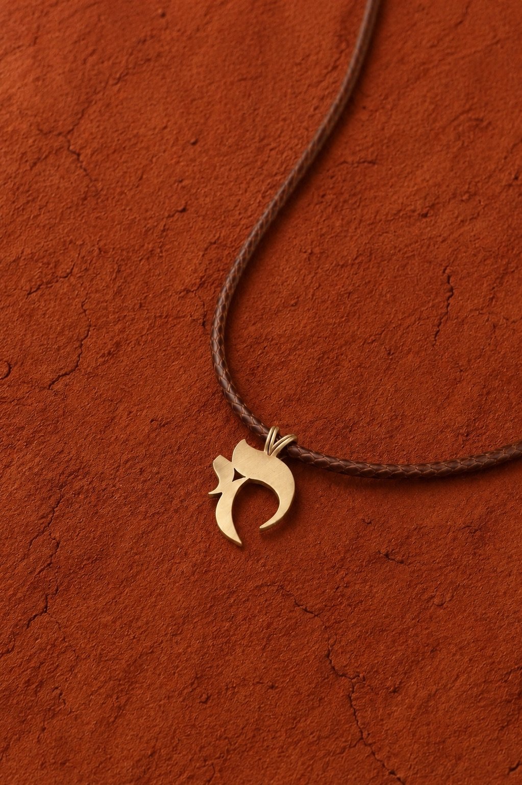 The crescent on its cord, on terracotta